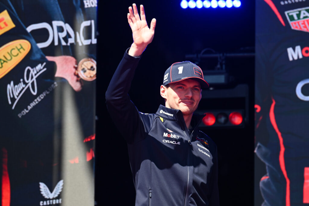 Max Verstappen of the Netherlands and Oracle Red Bull Racing waves at the crowd on the fan stage prior to final practice ahead of the F1 Grand Prix of Emilia-Romagna at Autodromo Internazionale Enzo e Dino Ferrari on May 17, 2025 in Imola, Italy.