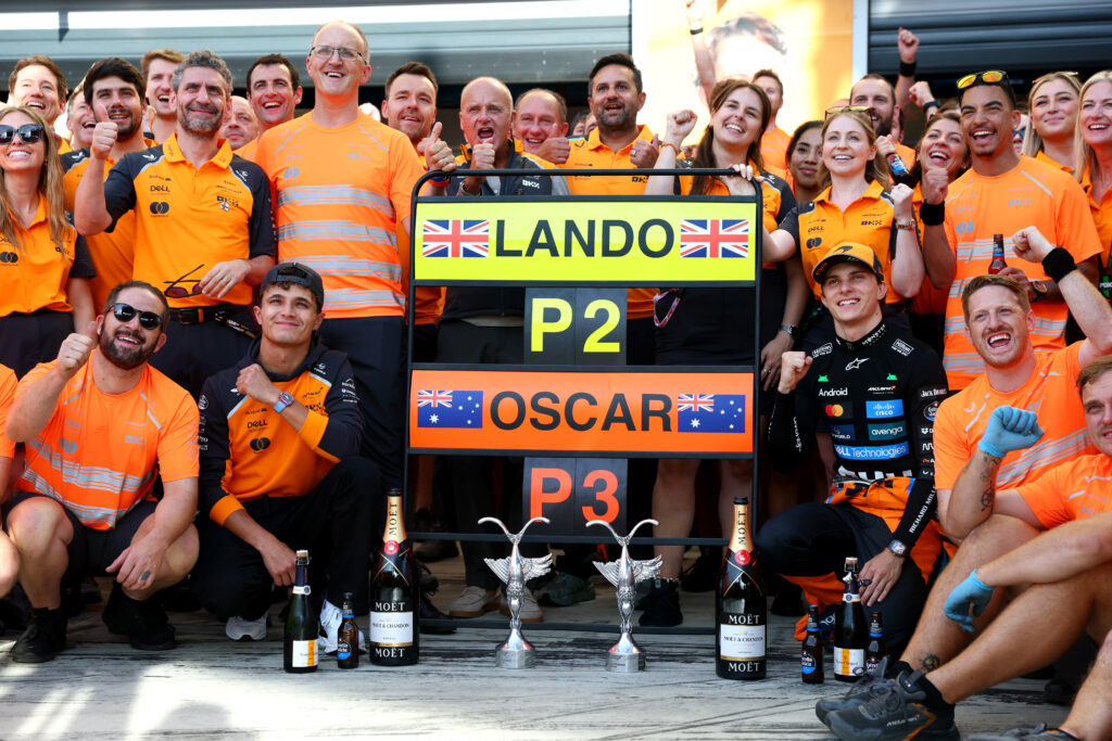 Second placed Lando Norris of Great Britain and McLaren Third placed Oscar Piastri of Australia and McLaren and the McLaren team celebrate during the F1 Grand Prix of Italy at Autodromo Nazionale Monza on September 07, 2025 in Monza, Italy.