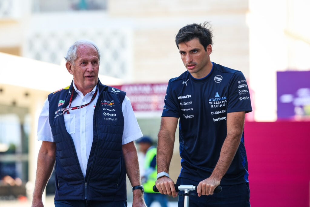 Williams driver Carlos Sainz walking with Red Bull team consultant Dr. Helmut Marko into the Lusail International Circuit in Qatar ahead of the Qatar Grand Prix.