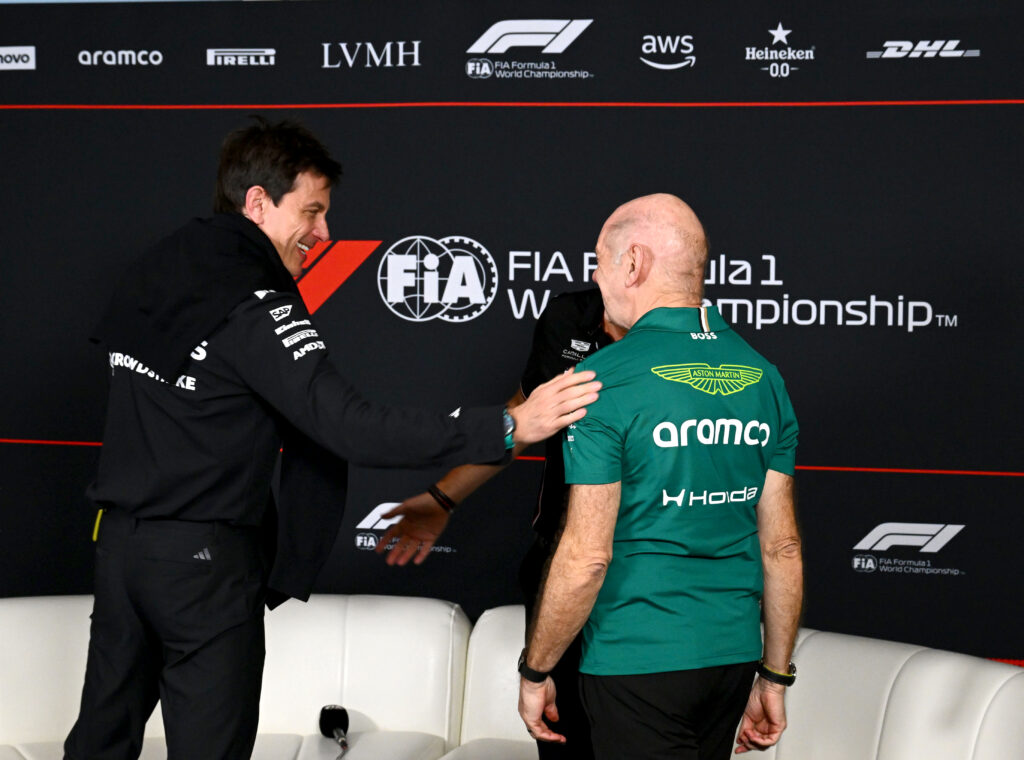 Mercedes CEO Toto Wolff greets Aston Martin team principal Adrian Newey.