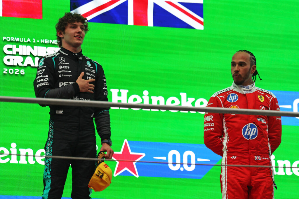 Mercedes driver Andrea Kimi Antonelli on the 2026 F1 Chinese Grand Prix podium with Ferrari's Lewis Hamilton