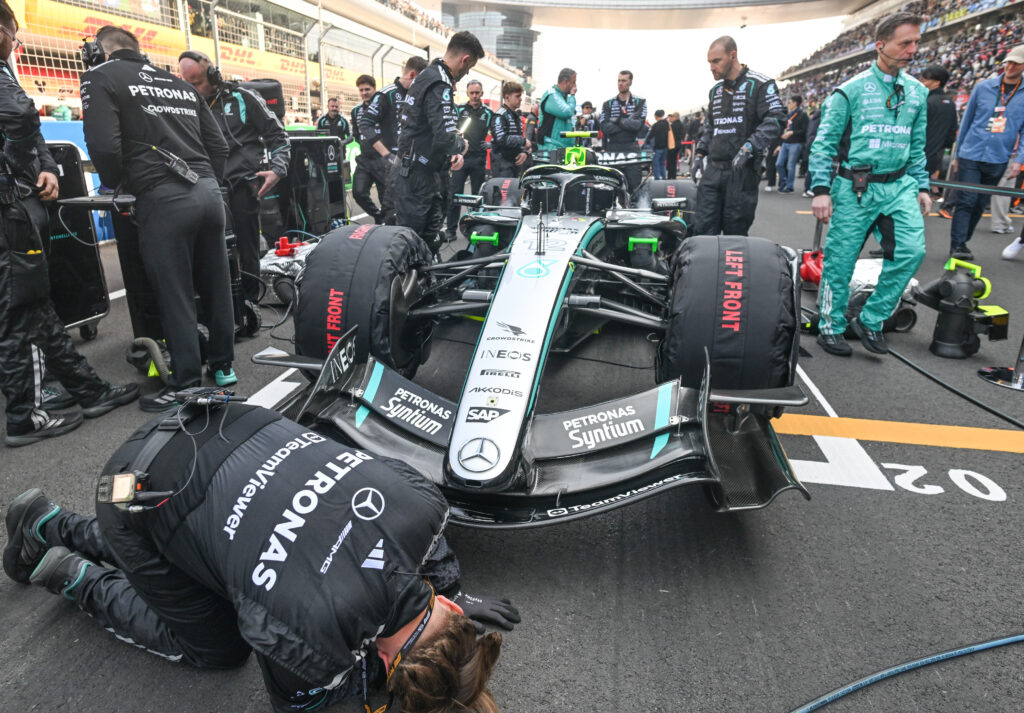 Mechanics make final adjustments to the Mercedes-AMG Petronas W17 of Kimi Antonelli ahead of the Sprint Race at the 2026 Chinese Grand Prix, at the Shanghai International Circuit, in Shanghai, China, on March 14, 2026.