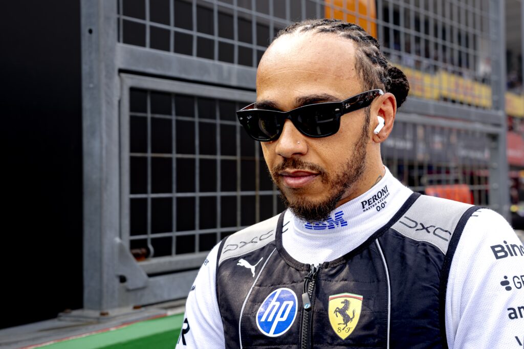 Ferrari driver Lewis Hamilton walking through the Suzuka Circuit at the 2026 Japanese Grand Prix.