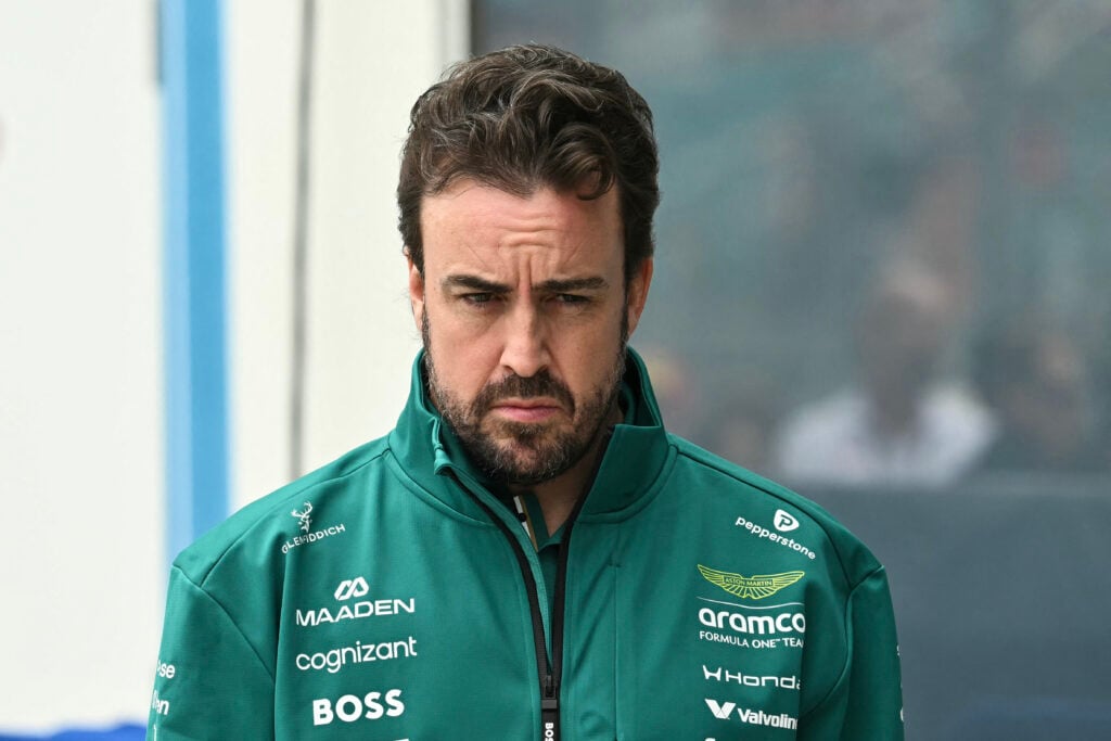 Aston Martin's Spanish driver Fernando Alonso arrives for the Driver's Parade before the 2026 Miami Formula One Grand Prix at Miami International Autodrome in Miami Gardens, Florida, on May 3, 2026. Due to weather and timing, the Driver's Parade took place as a series of interviews near the garages instead of an on track parade.