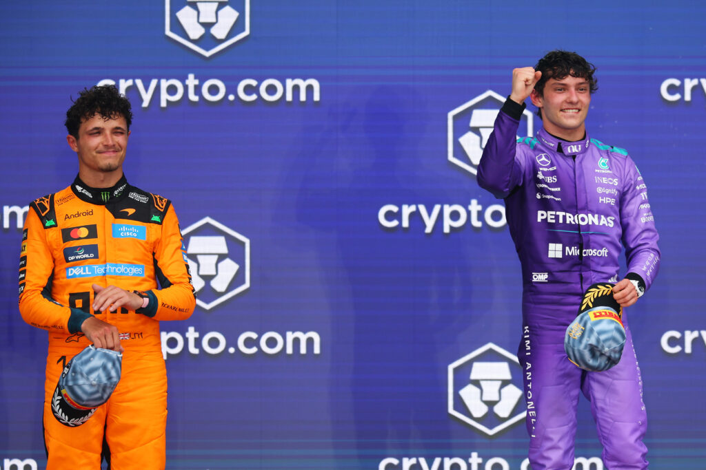 McLaren driver Lando Norris on the podium with Mercedes' Andrea Kimi Antonelli after the 2026 F1 Miami Grand Prix