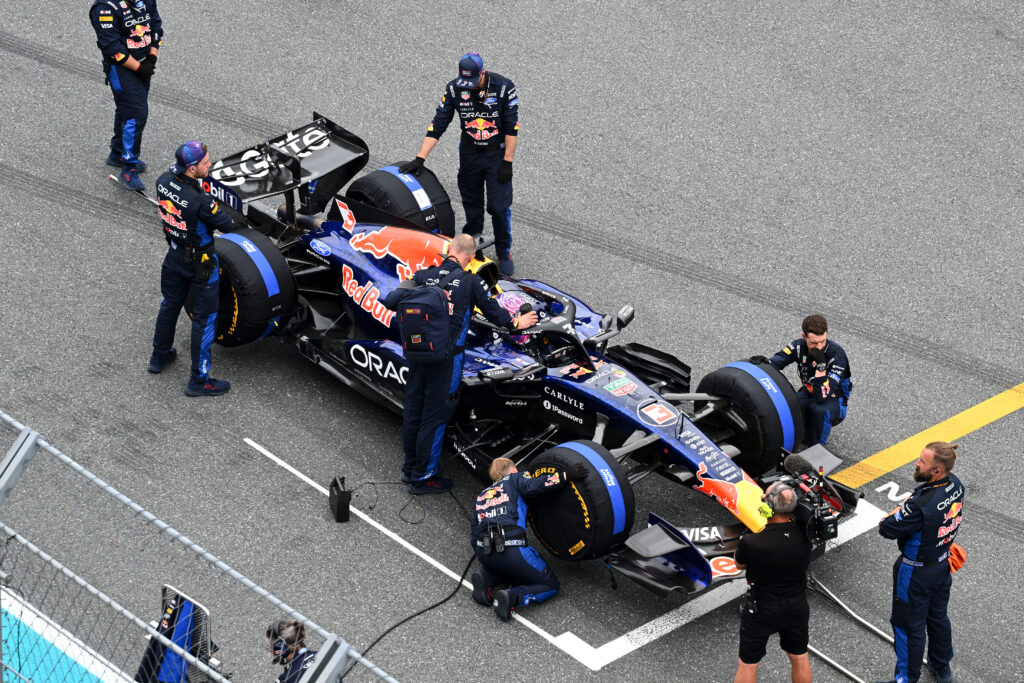 Red Bull engineers work on Max Verstappen's car on the grid before the 2026 F1 Miami Grand Prix