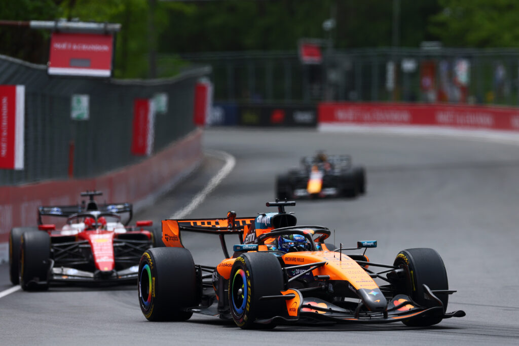 McLaren driver Oscar Piastri trying to defend against Ferrari driver Charles Leclerc during the 2026 Canadian Grand Prix.