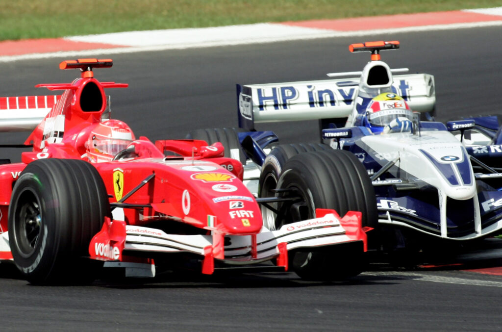Williams driver Mark Webber hits Ferrari's Michael Schumacher during the 2005 F1 Turkish Grand Prix