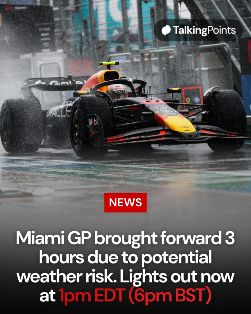 Image of Max Verstappen driving his Red Bull in wet conditions down the pit lane at the Miami Grand Prix