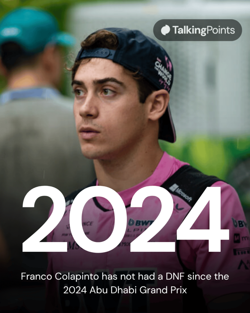 Alpine driver Franco Colapinto walking through the paddock at the 2025 Formula 1 Singapore Grand Prix