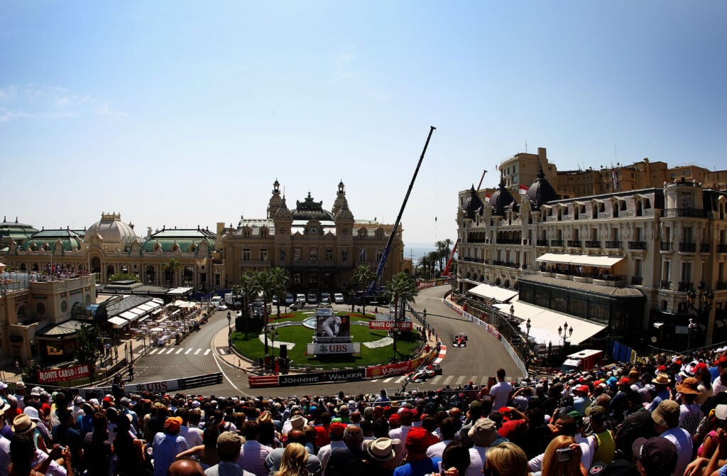 Fernando Alonso driving through Casino Square at the 2011 Monaco Grand Prix.