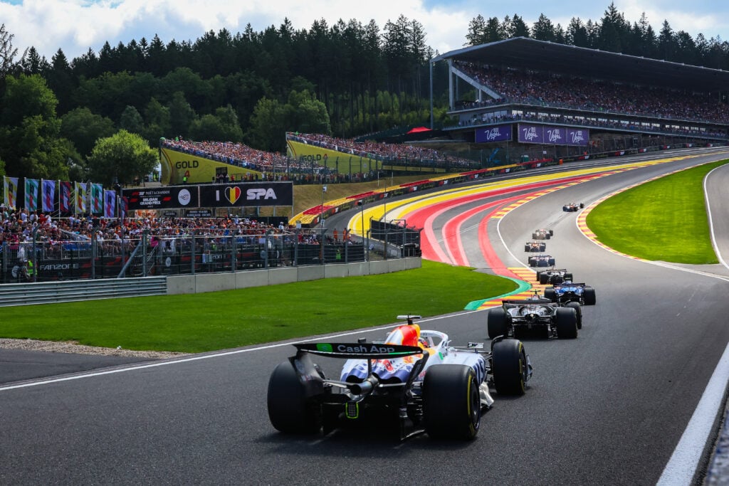 F1 cars drive up the Raidillon slope at Spa-Francorchamps during the Sprint race at the 2025 Belgium Grand Prix