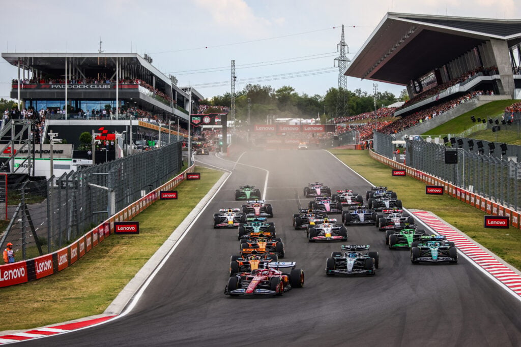 Charles Leclerc leads the F1 grid off the line at the start of the 2025 Hungarian Grand Prix
