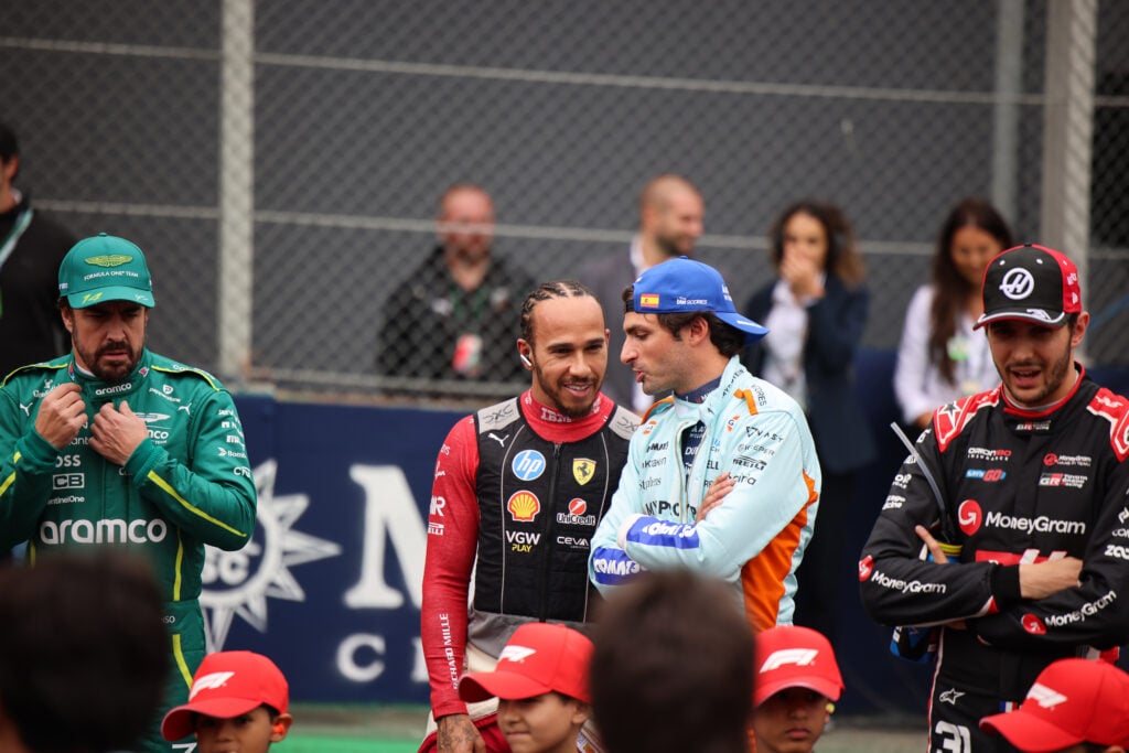 Carlos Sainz of Williams speaks with Lewis Hamilton of Ferrari ahead of the 2025 Brazilian Grand Prix.