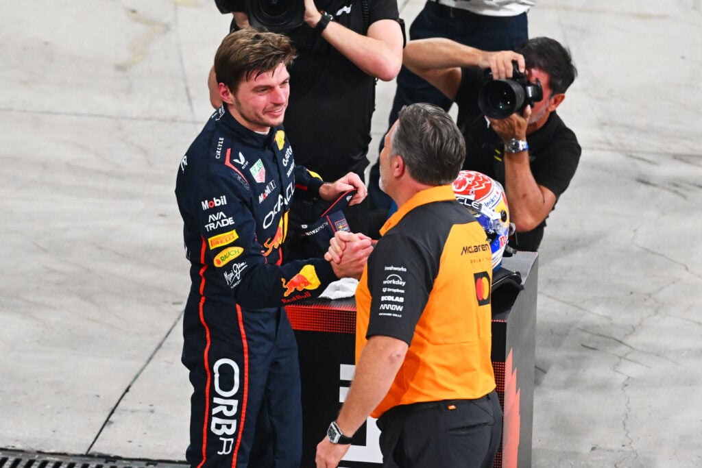 Max Verstappen of Red Bull greets McLaren CEO Zak Brown.