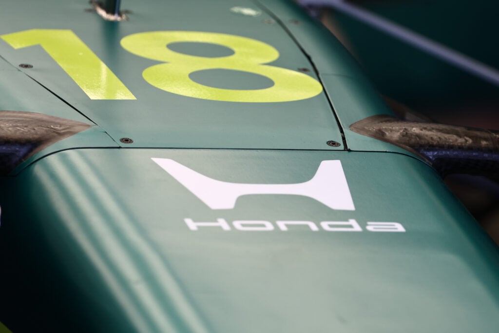 A view of the Honda logo on Lance Stroll's AMR26 Aston Martin F1 car.