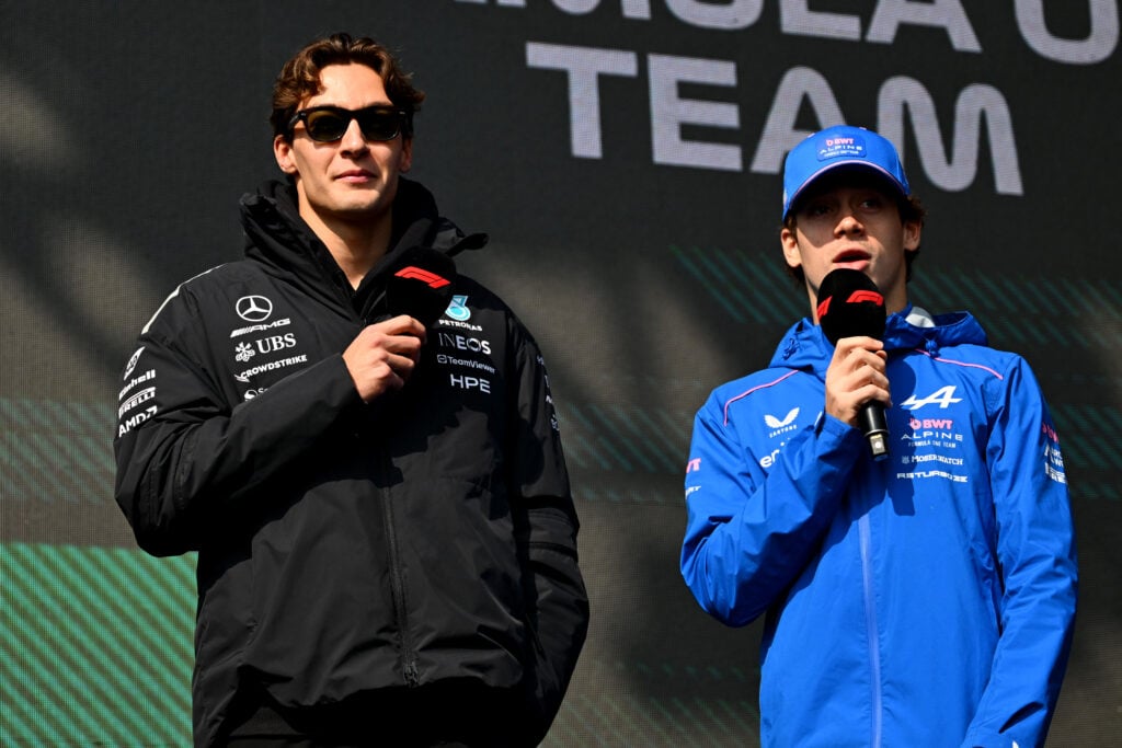 Mercedes driver George Russell with Franco Colapinto of Alpine speak on stage at the 2026 F1 Chinese Grand Prix