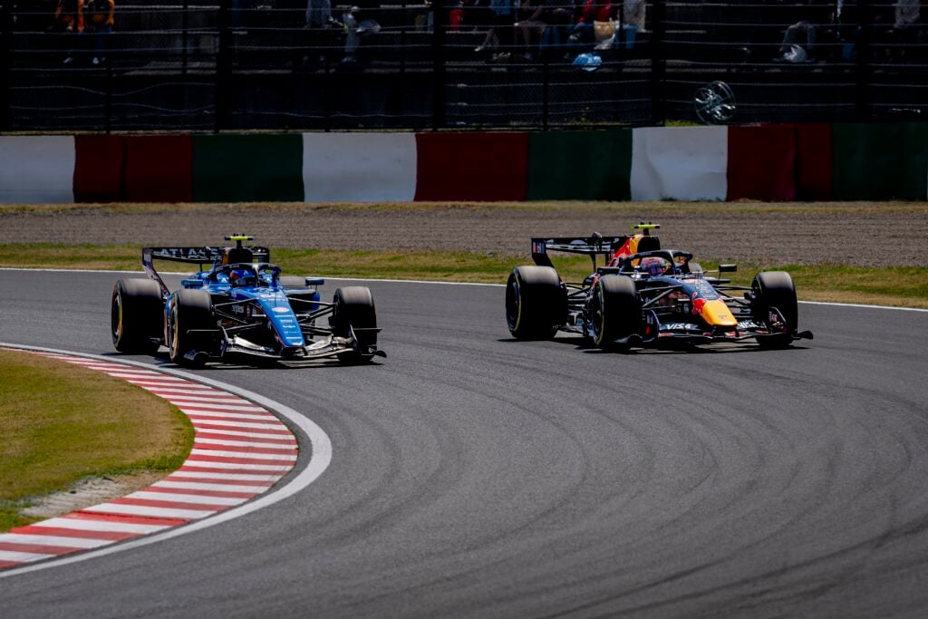 Red Bull driver Isack Hadjar leads Williams' Carlos Sainz on track during practice at the 2026 F1 Japanese Grand Prix
