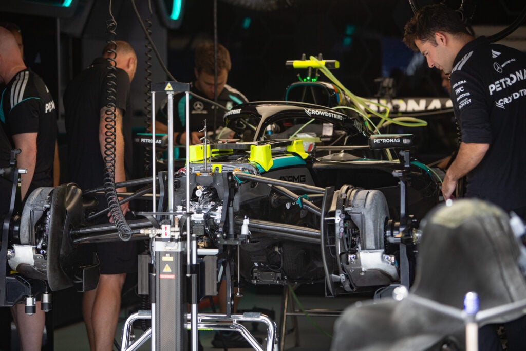 Mercedes engineers prepare the car in the garage ahead of the 2026 F1 Monaco Grand Prix
