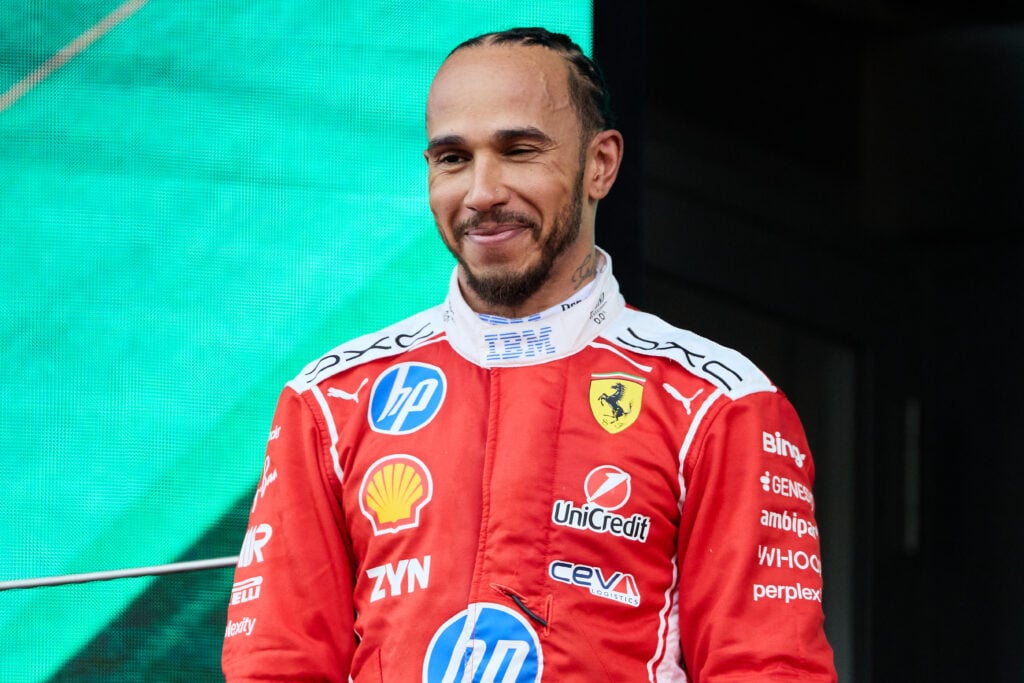 Lewis Hamilton of Ferrari on the podium after finishing P2 at the Monaco Grand Prix.