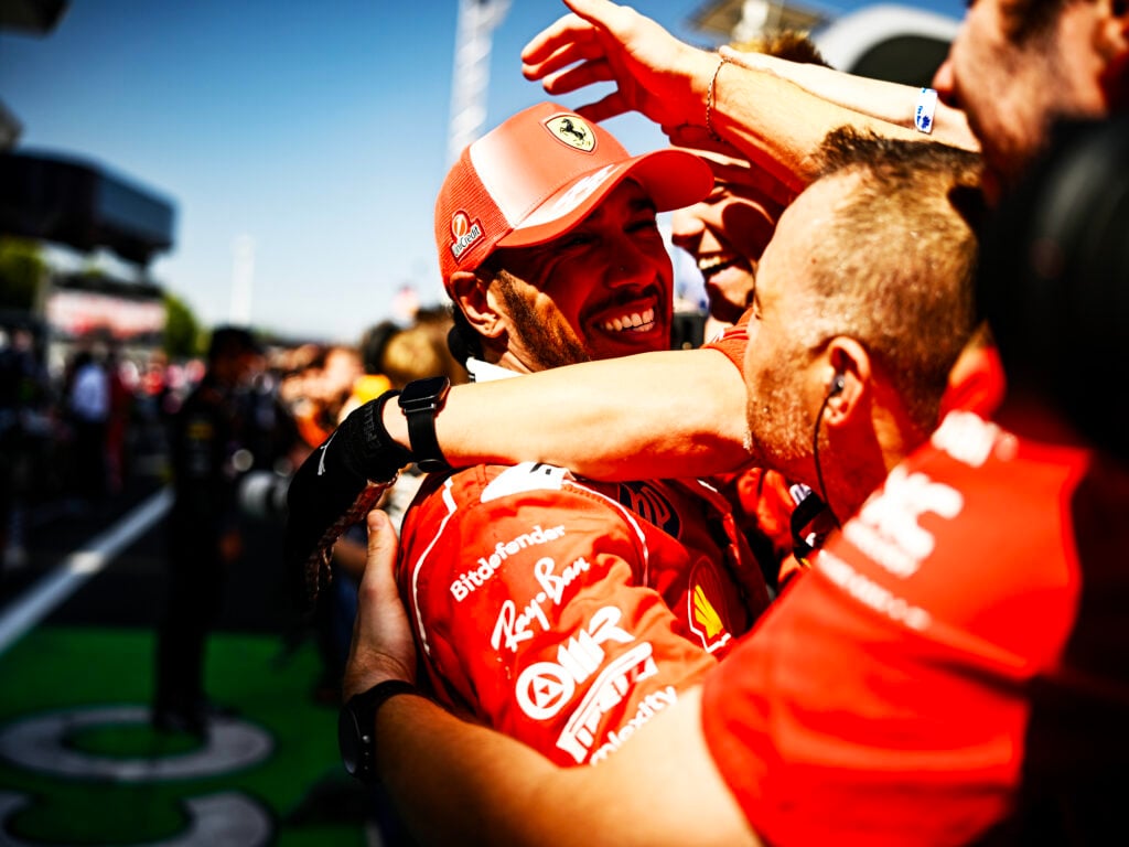 Lewis Hamilton celebrates with his Ferrari mechanics after winning the 2026 F1 Barcelona-Catalunya Grand Prix