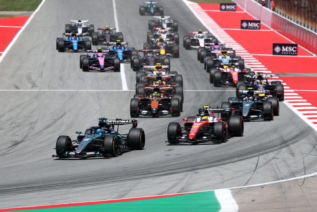 George Russell of Mercedes and Lewis Hamilton of Ferrari battle it out to start the 2026 Barcelona-Catalunya Grand Prix,