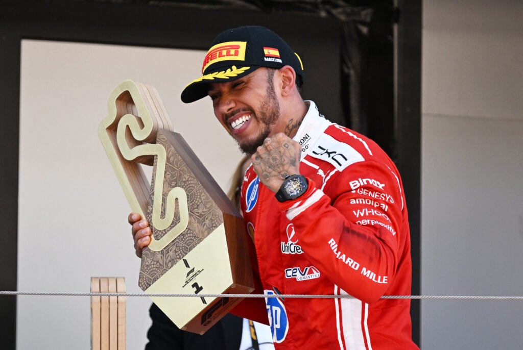 F1 Lewis Hamilton of Ferrari celebrates his maiden win with the team at the Barcelona-Catalunya Grand Prix.