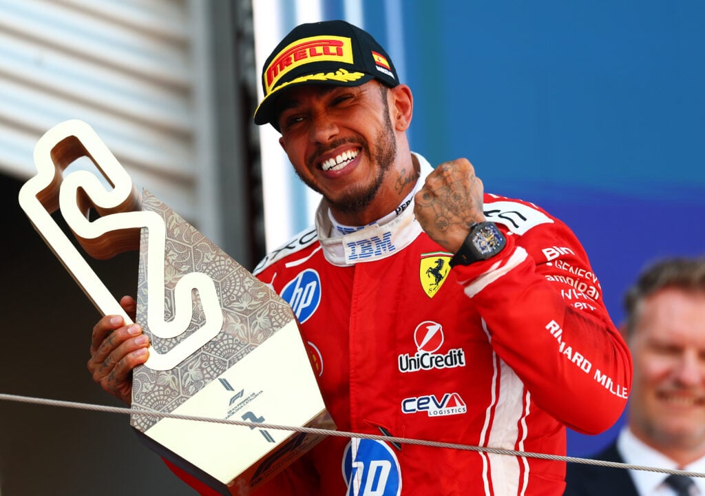 Lewis Hamilton of Ferrari celebrates winning the 2026 Barcelona-Catalunya Grand Prix.