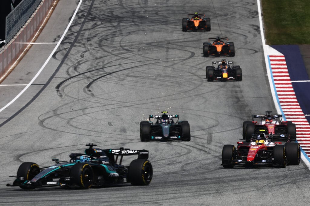Mercedes' George Russell leads Ferrari's Lewis Hamilton and Charles Leclerc at the start of the 2026 F1 Austrian Grand Prix