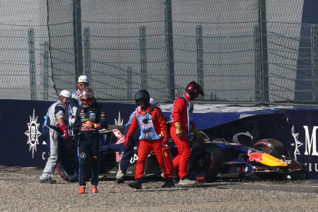 Red Bull driver Max Verstappen walks away after crashing during qualifying for the 2026 F1 Austrian Grand Prix
