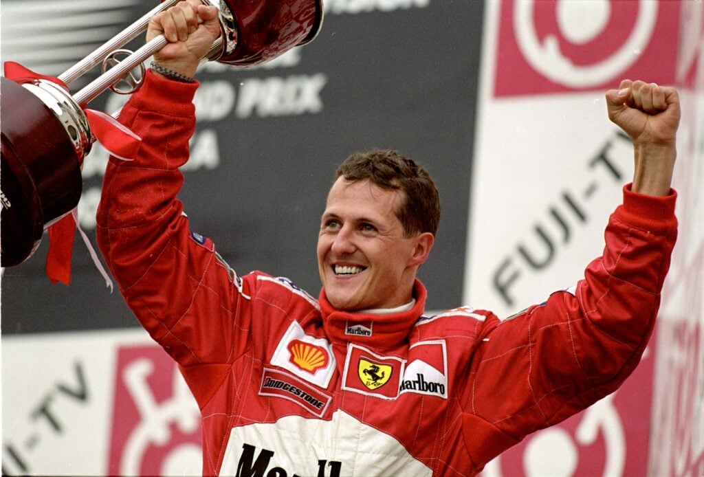 Michael Schumacher of Ferrari celebrates on the F1 podium in 2000