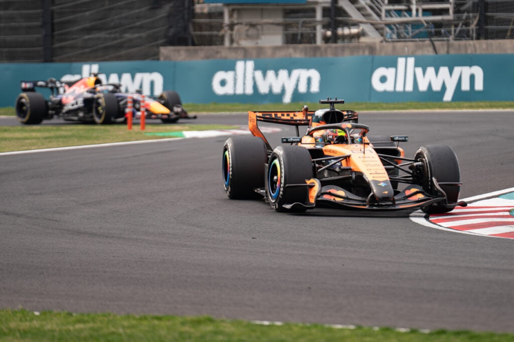 Oscar Piastri of McLaren leads Red Bull's Max Verstappen at the 2026 Japanese Grand Prix
