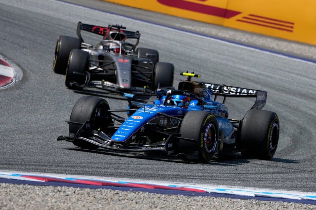 Williams driver Carlos Sainz leads Audi's Nico Hulkenberg on track during the 2026 F1 Austrian Grand Prix