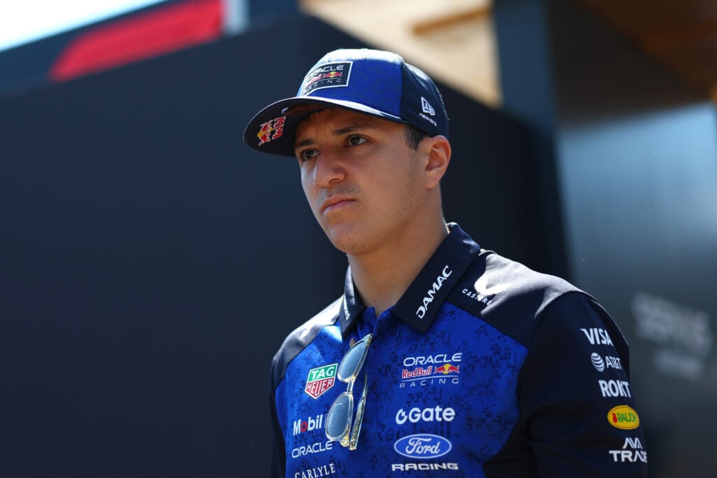 Isack Hadjar of Red Bull walks in the F1 paddock
