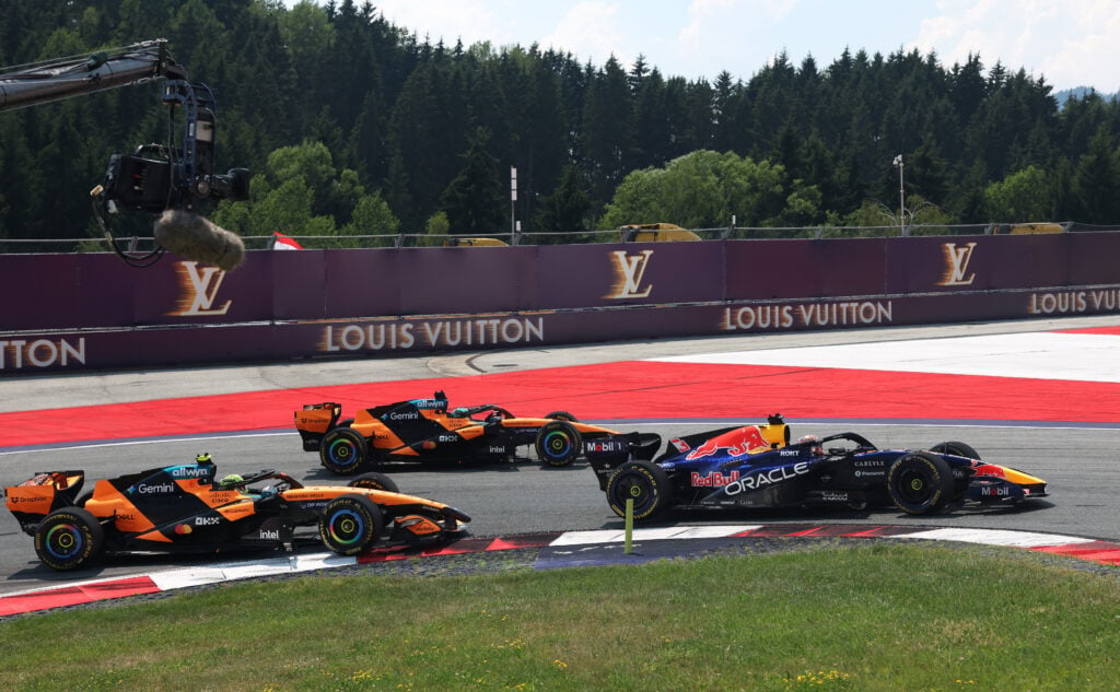 Max Verstappen racing ahead of the McLaren duo of Oscar Piastri and Lando Norris in the 2026 Austrian Grand Prix