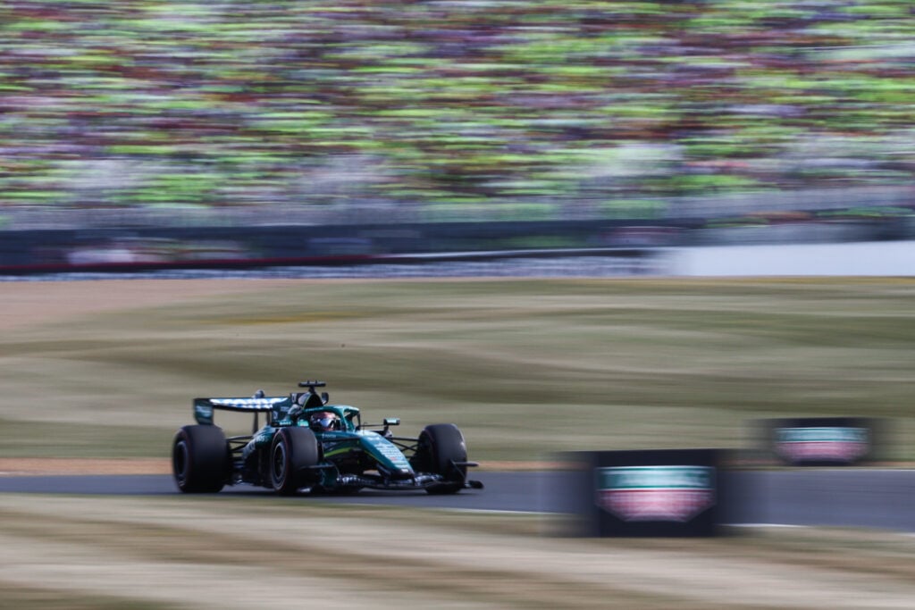 Aston Martin's Lance Stroll driving his F1 car during qualifying at the 2026 British Grand Prix.
