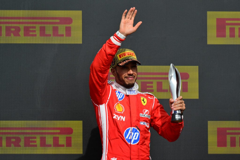Lewis Hamilton of Ferrari celebrates on the British Grand Prix podium