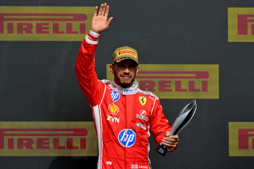 Lewis Hamilton of Ferrari waves on the British Grand Prix podium