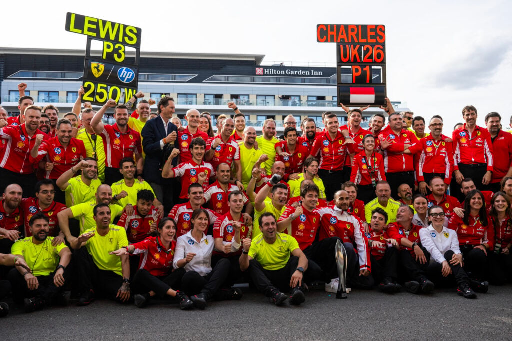 Scuderia Ferrari HP crew celebrate Charles Leclerc finishing P1 and Lewis Hamilton finishing P3 at the British Grand Prix.