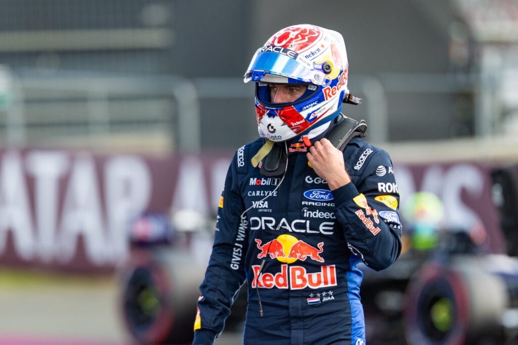 Max Verstappen walking through parc ferme after qualifying for the 2026 British Grand PRix.