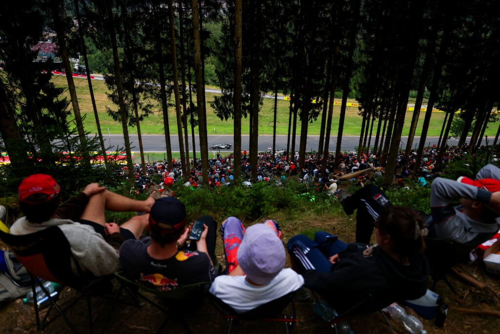 George Russell driving his Mercedes F1 car as fans watch on at the 2026 Belgian Grand Prix