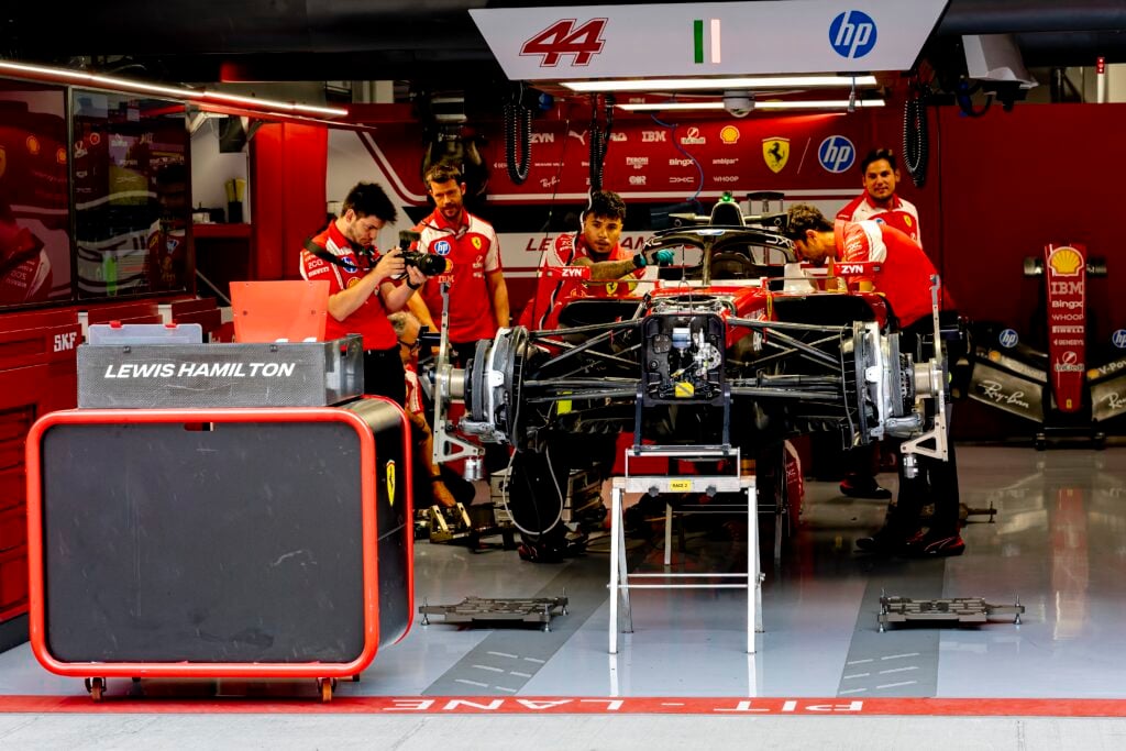 Ferrari work on Lewis Hamilton's car in the garage ahead of the 2026 F1 Hungarian Grand Prix