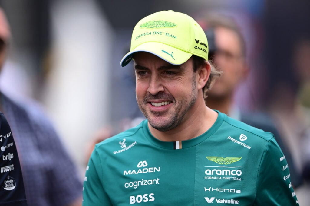 Fernando Alonso walking through the F1 paddock at the 2026 Hungarian Grand Prix.